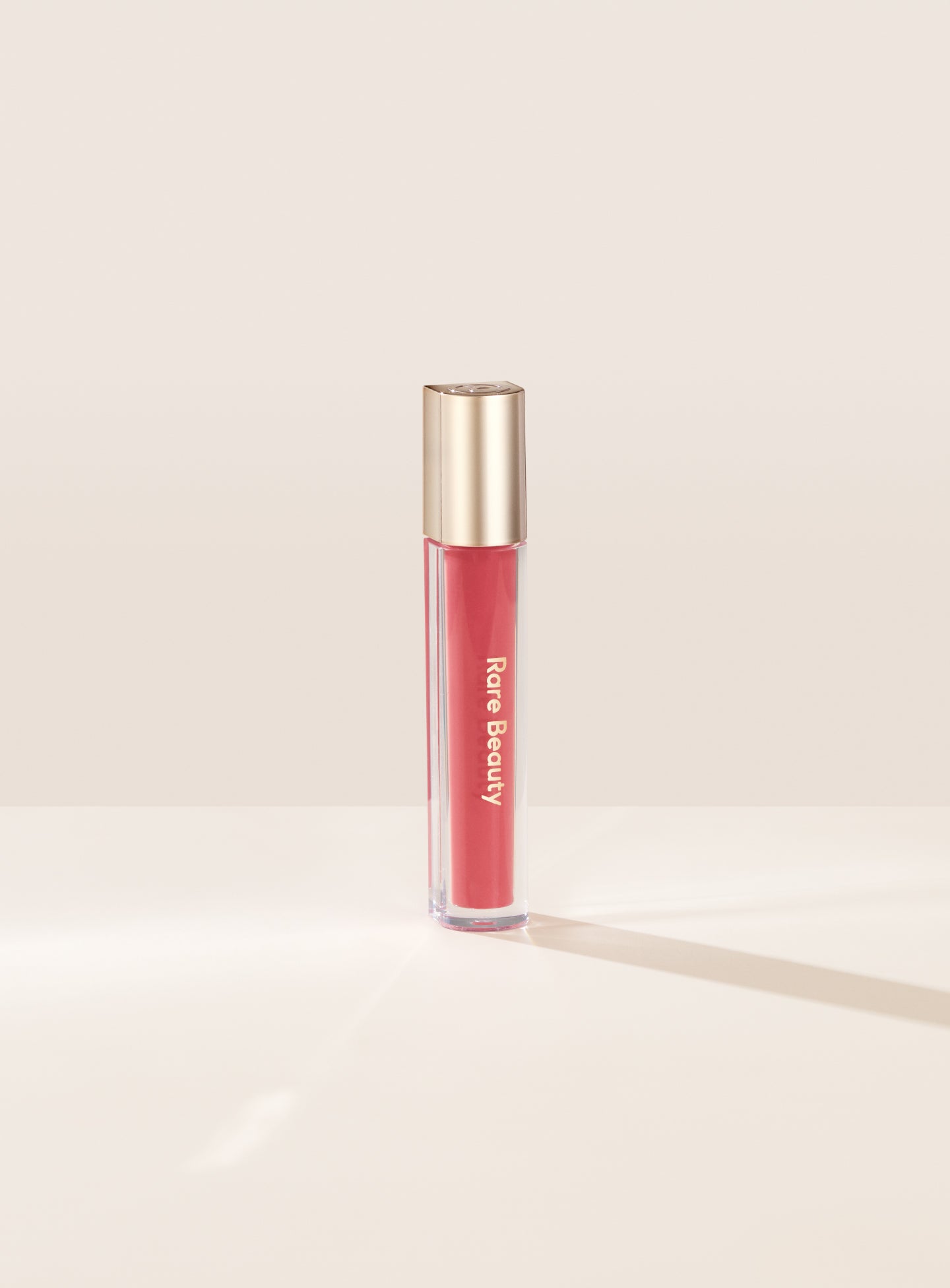 Rare Beauty Stay Vulnerable Glossy Lip Balm Nearly Apricot رير بيوتي بلسم الشفاه اللامع